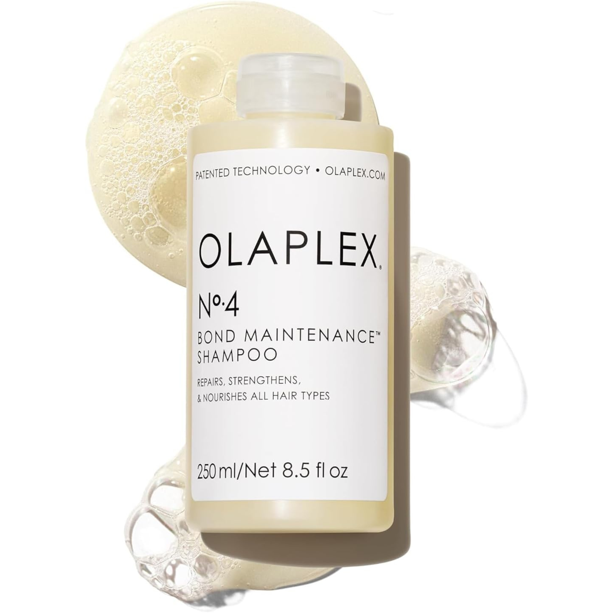 Olaplex No.4 Bond Maintenance Shampoo bottle with bubbles | pharmaelegance