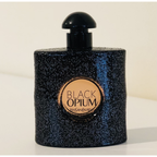 Yves Saint Laurent Black Opium perfume bottle on a light background
