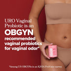 Person holding a pink container labeled 'URO' with text about URO Vaginal Probiotic on a red background.