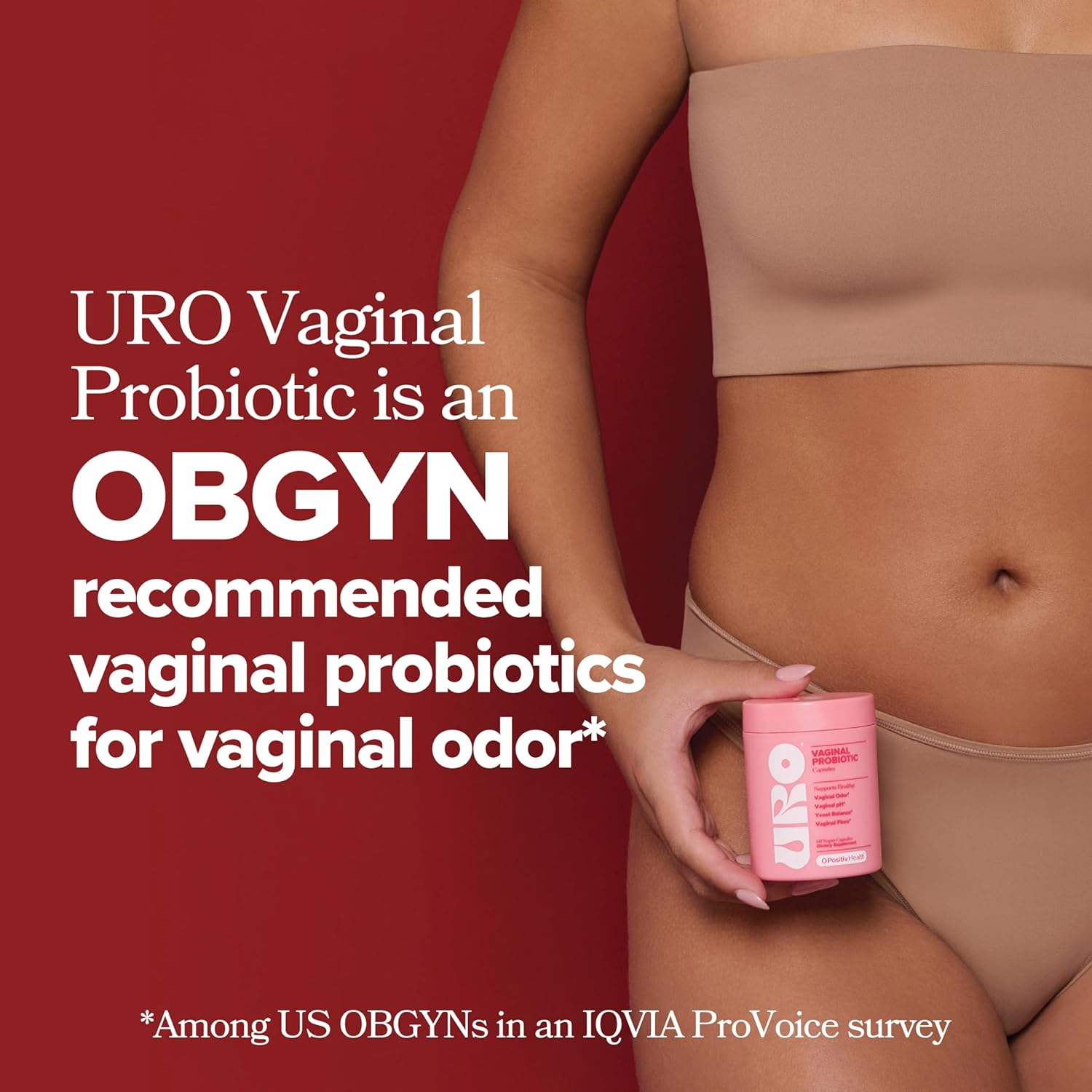 Person holding a pink container labeled 'URO' with text about URO Vaginal Probiotic on a red background.