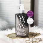 Bottle of WOW Color Wow hair product on a decorative tray with awards displayed.